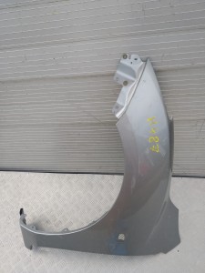 H487 BŁOTNIK LEWY PRZÓD MAZDA 2 2008 - 2013